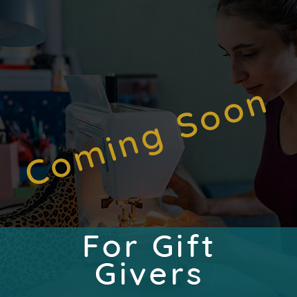 Woman sitting at a sewing machine stitching a purse representing tutorials for gift givers are coming soon.